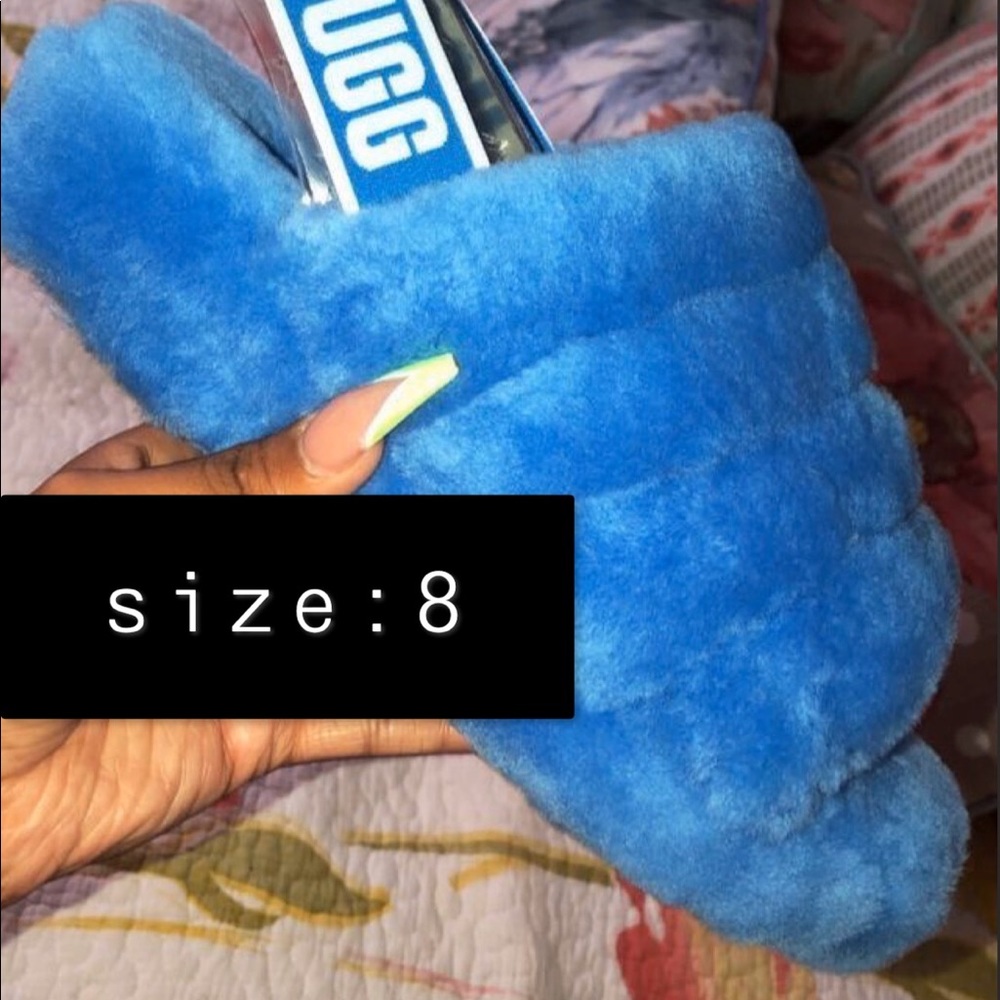 ugg fluffy slides in the color baby blue